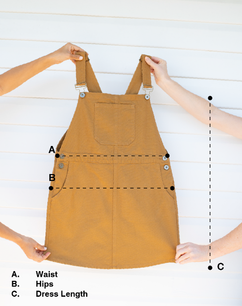 Caramel pinafore dress with measurements labeled on a white background